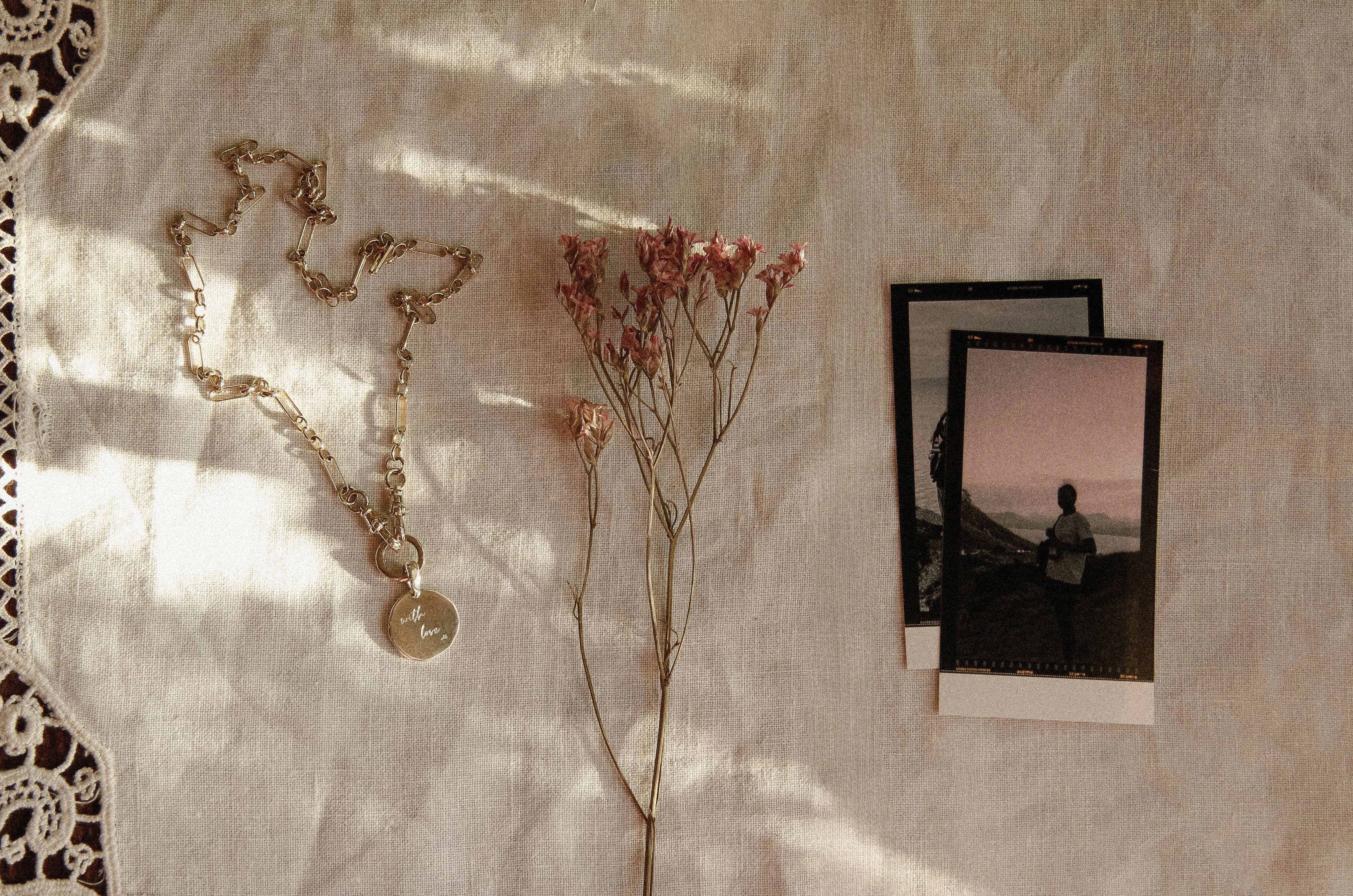 the best valentines day gifts for her necklace, flowers and printed photos