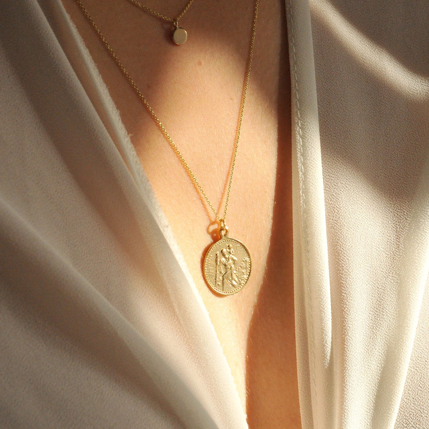 What is the meaning of Saint Christopher pendants?