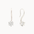 Pair of white gold hook earrings with round 5mm diamond against a white background