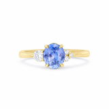 Cornflower Blue Sapphire with asymmetric Diamond cluster Engagement Ring on a white background