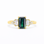 amazing Blue/Green Sapphire Baguette with Diamond Cluster Engagement Ring on a white background