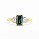 amazing Blue/Green Sapphire Baguette with Diamond Cluster Engagement Ring on a white background