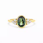 Bezel Oval Green Sapphire Diamond Cluster Engagement Ring on a white background