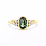Bezel Oval Green Sapphire Diamond Cluster Engagement Ring on a white background