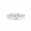 diamond ring in white gold with bezel set round and pear shaped diamonds on a white background