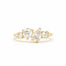 18ct yellow gold cluster engagement ring with round and pear diamonds on a white background