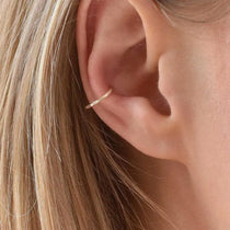 solid gold conch piercing hoop worn in ear