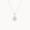 white gold pendant necklace with molten-effect gold and round diamond on a white background