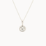 white gold pendant necklace with molten-effect gold and round diamond on a white background
