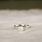 chunky white gold engagement ring with cushion cut diamond