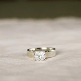 chunky white gold engagement ring with cushion cut diamond