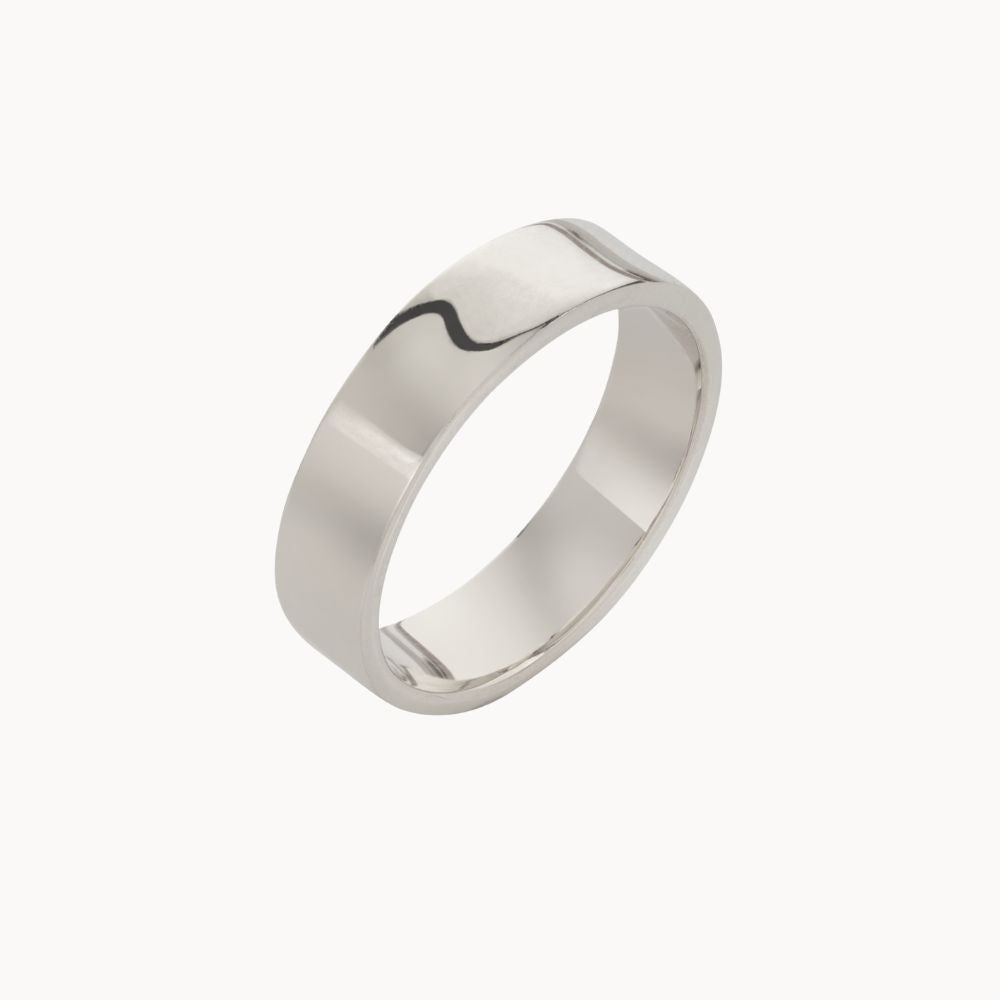 5mm wide 9ct white gold wedding ring with a polished finish on a white background