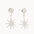 White gold diamond stud earrings with sun-shaped charms hanging off them against a white background