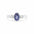 white gold bezel set blue sapphire trilogy engagement ring with diamonds on a white backdrop