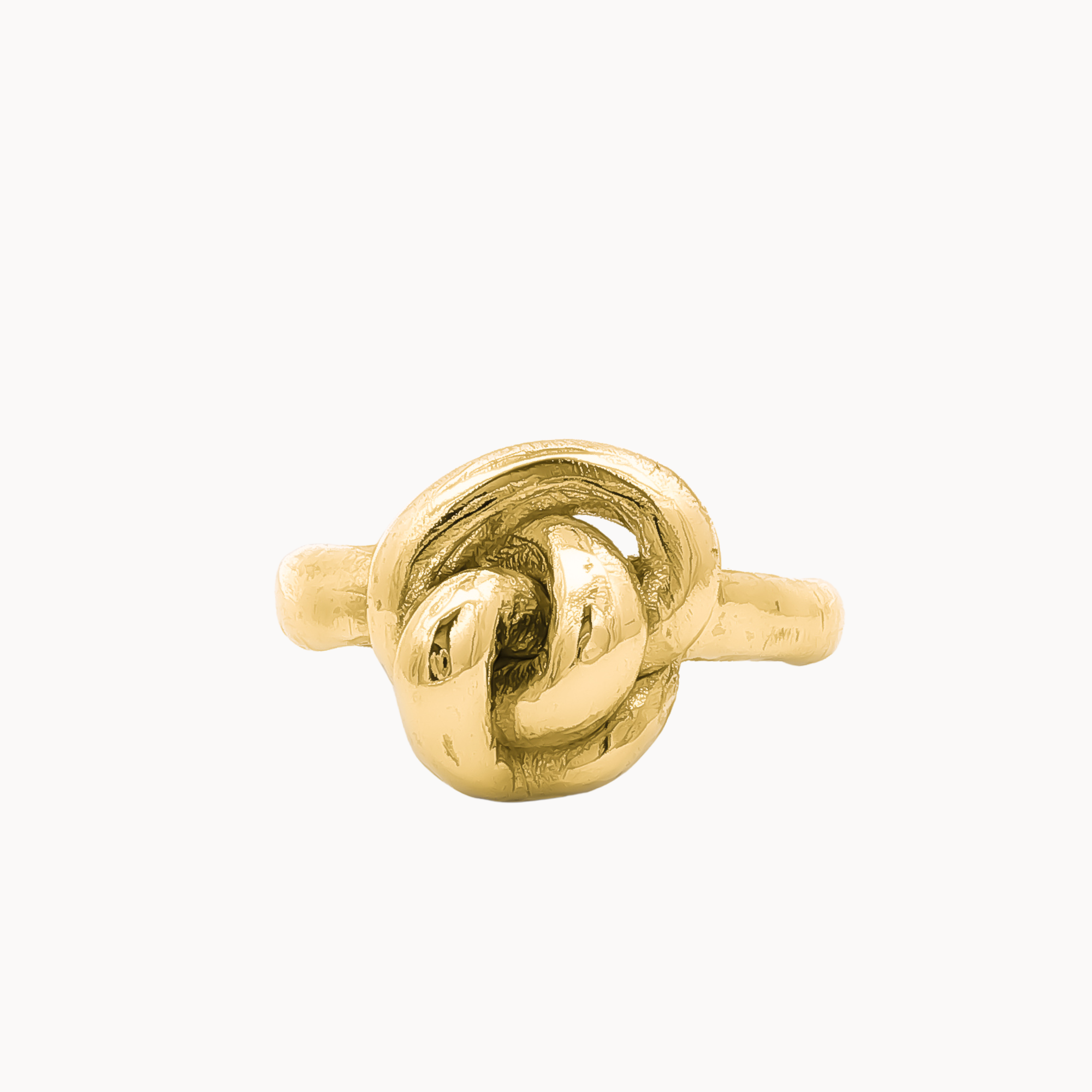 A gold ring featuring a sculpted, polished knot design on a slender band, set against a plain off-white background.