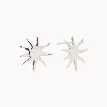 Pair of silver sun-shaped stud earrings on a white background