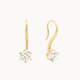 gold hook earrings with molten texture and round diamonds on a white background