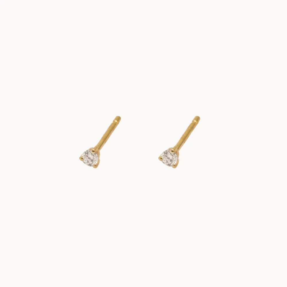 pair of diamond 2mm diamond stud earrings set in yellow gold