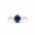 white gold engagement ring with a blue sapphire and two smaller diamonds on a white background