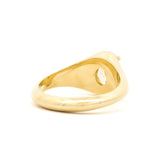 A polished yellow gold signet ring with a yellow diamond, shown from a back view on a white background.