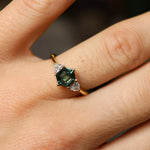 hexagon green sapphire engagement ring on hand
