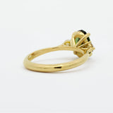 High-Set Elongated Oval Green Sapphire and Diamond Trilogy Engagement Ring back view showing high-set basket