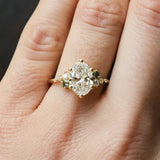 Gold ring with a diamond on a person's finger