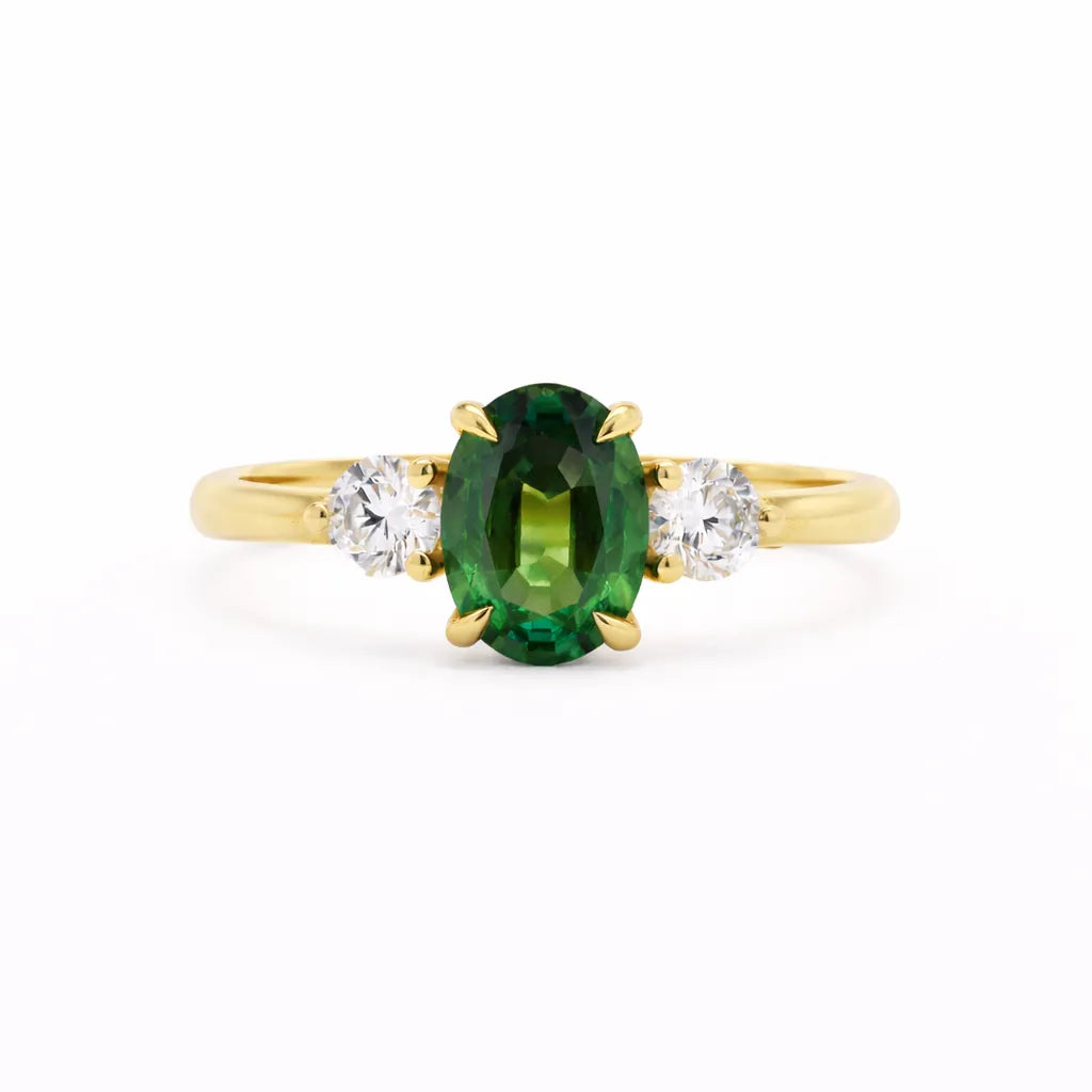 9ct Gold Three Stone Green Sapphire Lowfit Engagement Ring on a white background
