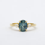 Blue Oval Sapphire Engagement Ring with Pear Accent Diamonds