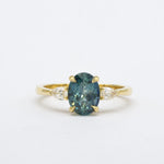 Blue Oval Sapphire Engagement Ring with Pear Accent Diamonds