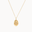 Gold cancer crab necklace with an oval pendant on a white background