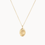 Gold capricorn necklace with a pendant on a white background