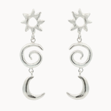 Silver earrings with sun, spiral, and crescent moon designs on a white background