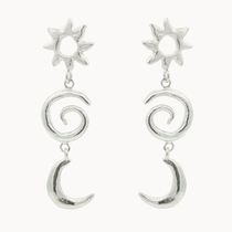 Silver earrings with sun, spiral, and crescent moon designs on a white background