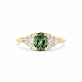 13 stone engagement ring with one oval sapphire and different shaped diamonds on a white background