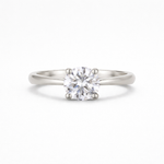 platinum solitaire diamond engagement ring on a white background