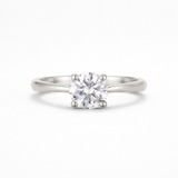 platinum solitaire diamond engagement ring on a white background