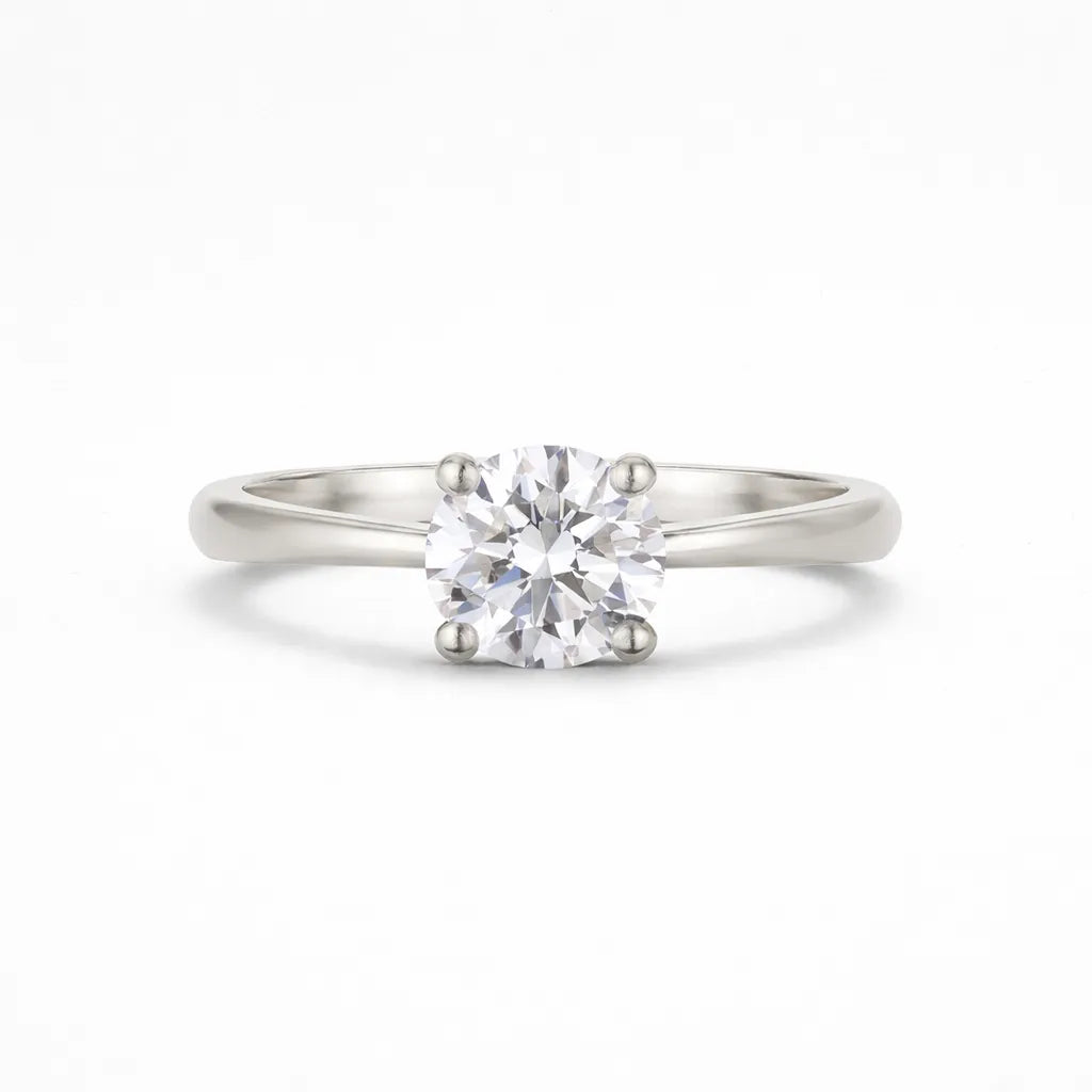 platinum solitaire diamond engagement ring on a white background