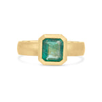 Emerald solitaire wide band engagement ring