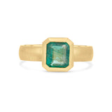Emerald solitaire wide band engagement ring