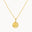 Gold necklace with a round moonlight pendant on a white background
