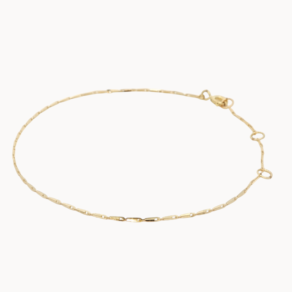 Gold bracelet on a white background