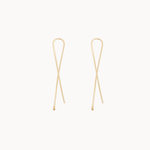 twisted gold earrings on white background