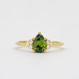 Green Pear Sapphire With Diamond Cluster Detail Engagement Ring