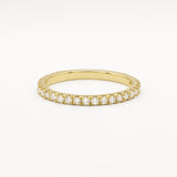 Gold eternity wedding ring in 1.6mm width with small diamonds on a white background