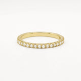 Gold eternity wedding ring in 1.6mm width with small diamonds on a white background