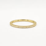 Gold eternity wedding ring with 1mm small diamonds on a white background