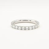 white gold diamond 2.3mm wide eternity wedding ring on a white background