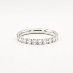 white gold diamond 2.3mm wide eternity wedding ring on a white background