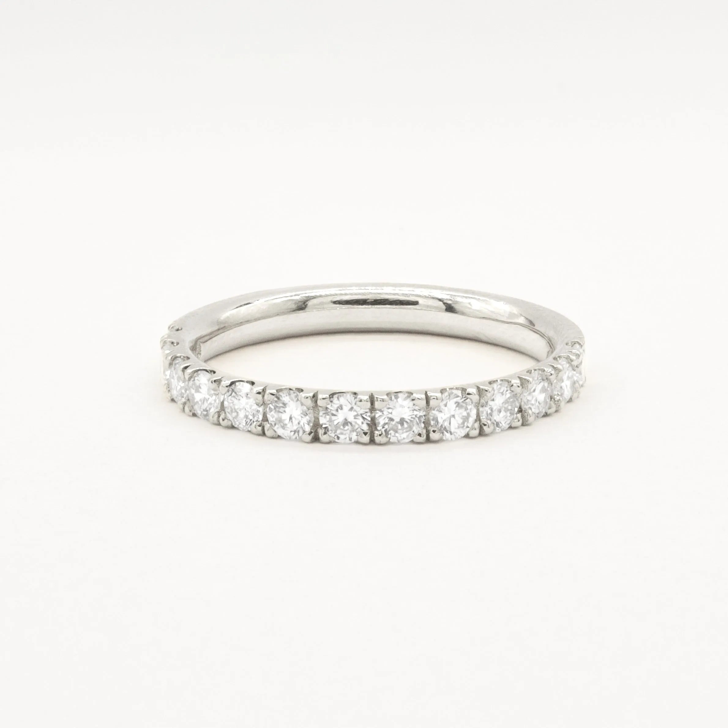 white gold diamond 2.3mm wide eternity wedding ring on a white background
